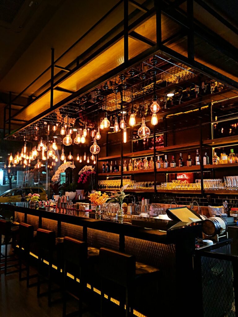 Brick-walled bar counter with taps at Jail House Pub