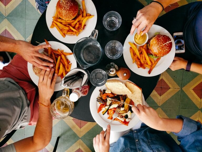 Friends sharing food on a group booking at Jail House Pub, Nuneaton